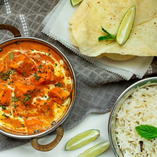 Taste of Punjab's paneer butter masala, cumin rice, and flatbread with lime and mint.
